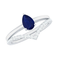 Pear cut blue sapphire solitaire ring set with diamond enhancer band, showcasing elegant jewelry design by Rosec Jewels.