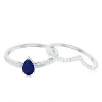 Pear cut blue sapphire solitaire ring set with diamond enhancer band by Rosec Jewels, showcasing the elegant jewelry design.