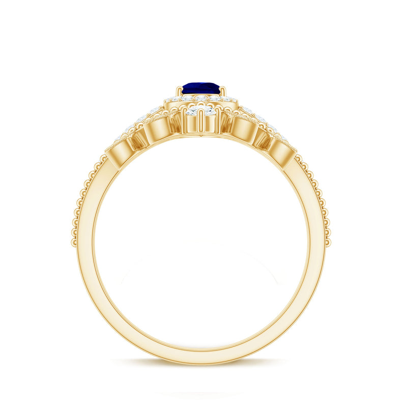 Blue sapphire pear-shaped engagement ring set with diamonds by Rosec Jewels, featuring a stunning blue sapphire center and sparkling side stones.