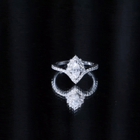 Marquise cut moissanite engagement ring by Rosec Jewels featuring a sparkling yellow gemstone and elegant band design.