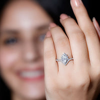 Marquise cut moissanite designer engagement ring from Rosec Jewels featuring a sparkling central stone and intricate band detail.