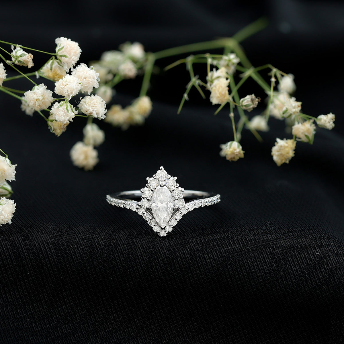 Marquise cut moissanite designer engagement ring by Rosec Jewels featuring a sparkling central stone and elegant band design.