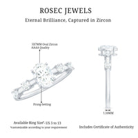 Oval cubic zirconia solitaire engagement ring for women with a sleek band, featuring a sparkling central stone.