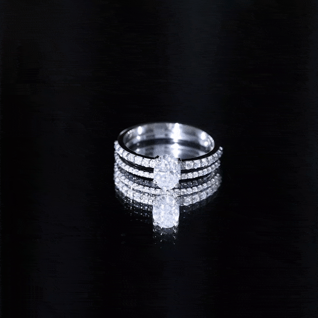 Oval-shaped moissanite engagement ring with matching wedding band set from Rosec Jewels, featuring sparkling stone details.