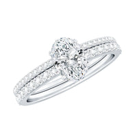 Oval-shaped moissanite engagement ring and wedding band set by Rosec Jewels, featuring sparkling center stones and elegant design.