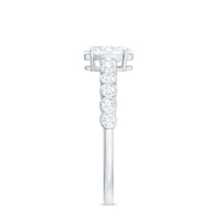 Oval cut moissanite engagement ring with side stones from Rosec Jewels showcasing the sparkling ring design.