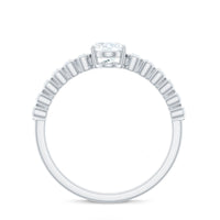 Oval cut Moissanite engagement ring with side stones featuring a sleek band and sparkling center stone, by Rosec Jewels.
