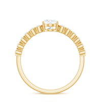 Oval cut moissanite engagement ring with side stones, featuring a silver band and intricate detailing, by Rosec Jewels.