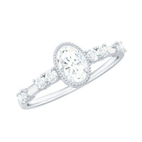 Oval shape zircon solitaire engagement ring with side stones, crafted by Rosec Jewels, featuring a sparkling central gemstone and elegant band.