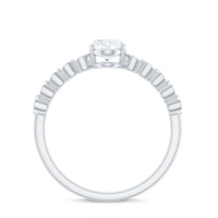 Certified Moissanite oval cut engagement ring with side stones showcasing a detailed view of the ring's elegant design and sparkling gemstones.