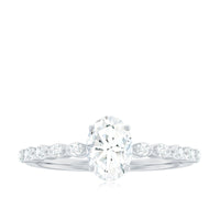 Oval cut 1.75 CT zircon solitaire engagement ring with side stones, featuring a polished band and detailed setting.