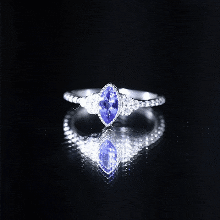 Vintage style marquise tanzanite promise ring with diamond trio by Rosec Jewels, featuring a yellow gold band and intricate design.