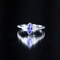 Vintage style marquise tanzanite promise ring with diamond trio by Rosec Jewels, featuring a yellow gold band and intricate design.