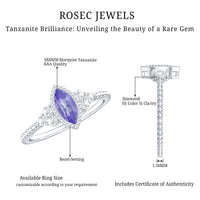 Vintage style marquise tanzanite promise ring with diamond trio, featuring intricate detailing and elegant design.
