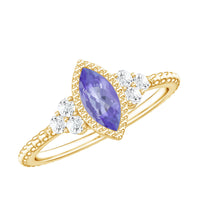 Vintage style marquise tanzanite promise ring with diamond trio featuring Rosec Jewels' elegant design and intricate craftsmanship.