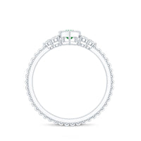 Vintage inspired emerald engagement ring with trio diamonds, crafted by Rosec Jewels, featuring detailed band and elegant design.