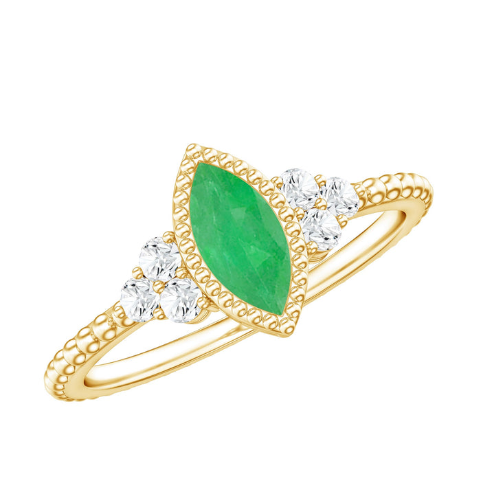 Vintage-inspired emerald engagement ring with trio diamonds by Rosec Jewels, featuring a detailed band and sparkling gemstones.