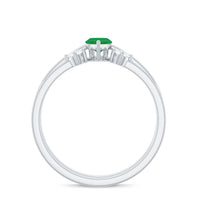 Pair of natural marquise emerald diamond promise rings by Rosec Jewels with sparkling emerald and diamond accents on silver bands.