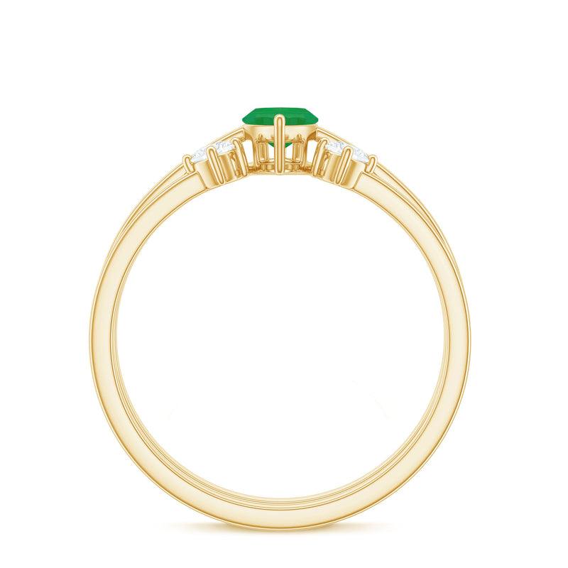 Natural marquise emerald and diamond promise ring set by Rosec Jewels, showcasing two elegant rings with green emeralds and sparkling diamonds