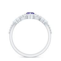 Natural Marquise Tanzanite and diamond engagement ring set by Rosec Jewels, showcasing the elegant marquise-cut tanzanite and sparkling diamonds.