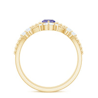 Natural marquise Tanzanite and diamond engagement ring set by Rosec Jewels featuring a stunning marquise-cut Tanzanite surrounded by diamonds.