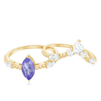 Natural marquise tanzanite diamond engagement ring set featuring a Rosec Jewels rings with marquise-cut tanzanite and sparkling diamonds.