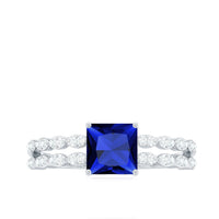 Rosec Jewels 1.5 Carat Princess Cut Lab Grown Blue Sapphire engagement ring with double band and diamond accents.