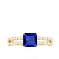 Certified 1.5 carat princess cut lab-grown blue sapphire double band engagement ring with diamonds by Rosec Jewels.