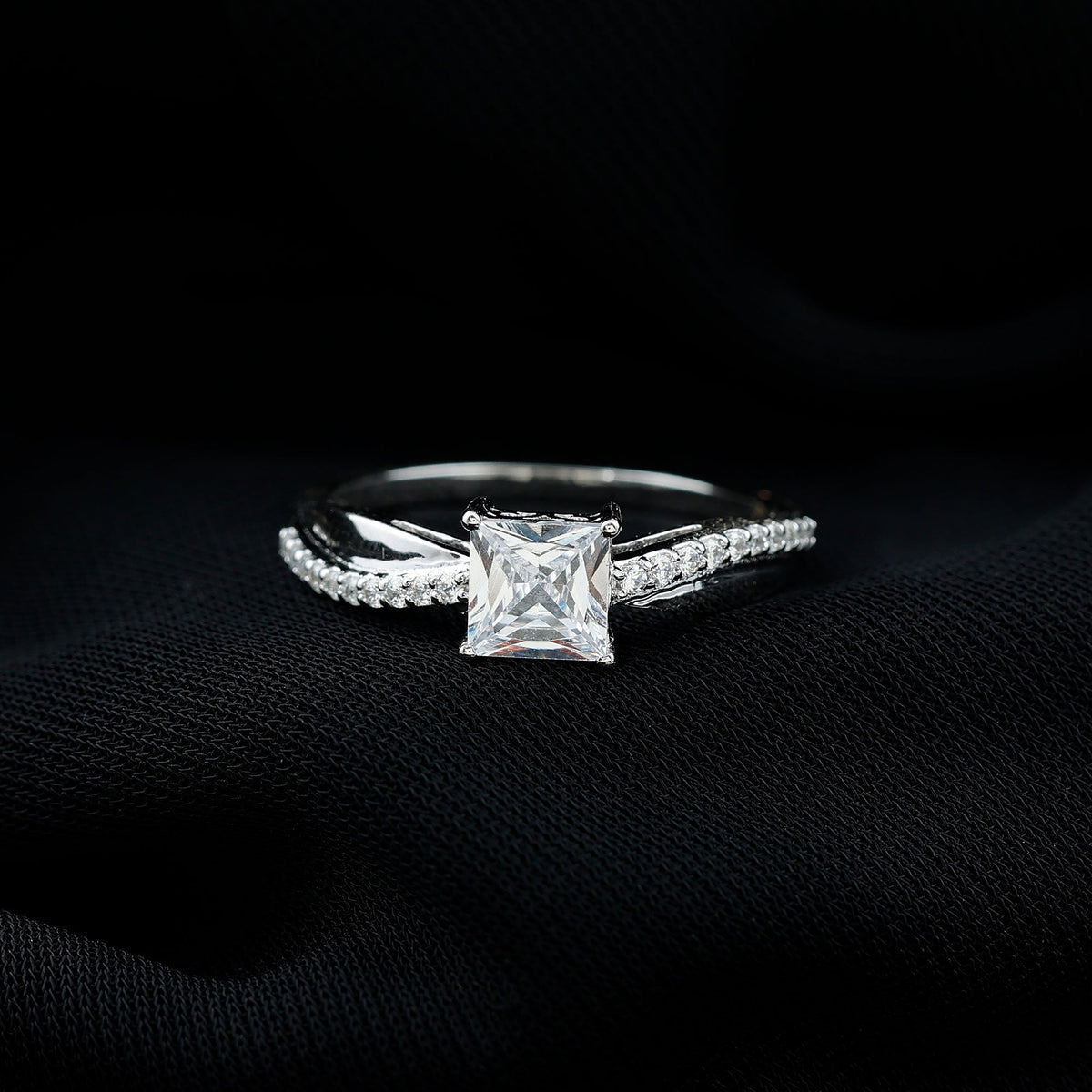 Rosec Jewels 1 Carat princess cut cubic zirconia solitaire engagement ring with a sleek band and sparkling center stone.