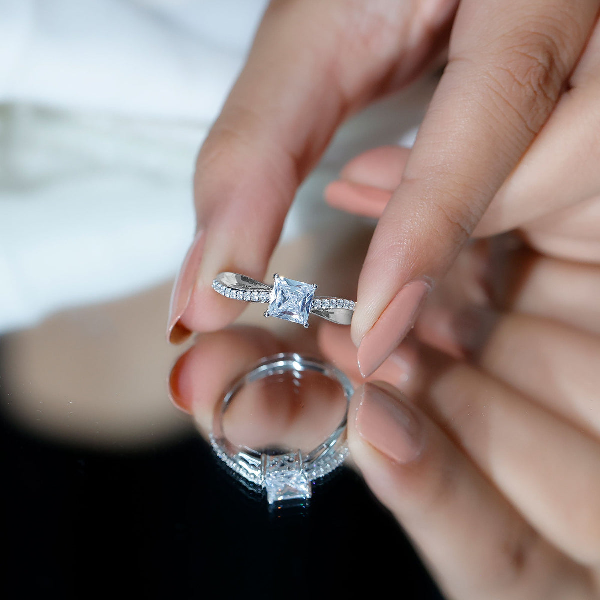 Rosec Jewels 1 Carat princess cut cubic zirconia solitaire engagement ring with a sleek band and sparkling center stone.
