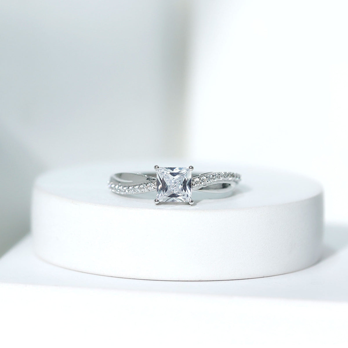Rosec Jewels 1 Carat princess cut cubic zirconia solitaire engagement ring with a sleek band and sparkling center stone.