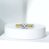 Rosec Jewels 1 Carat Princess Cut Cubic Zirconia Solitaire Engagement Ring with a sleek silver band on a white background.