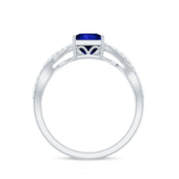 Lab grown 1.5 carat blue sapphire princess cut engagement ring with diamond crossover shank by Rosec Jewels.
