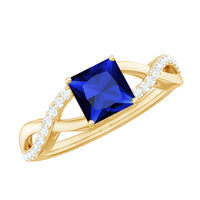 Lab grown 1.5 carat blue sapphire engagement ring with princess cut center and diamond crossover shank, by Rosec Jewels