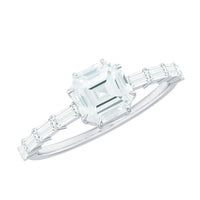 Asscher cut moissanite engagement ring with baguette side stones and rose gold band by Rosec Jewels.