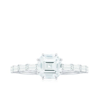 Asscher cut moissanite engagement ring by Rosec Jewels featuring baguette side stones and a silver band.