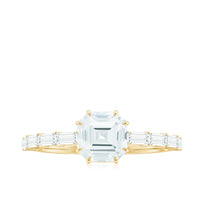 Asscher cut Moissanite engagement ring by Rosec Jewels with baguette side stones, showcasing a sparkling center stone and elegant design.