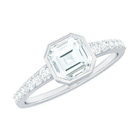 Asscher cut moissanite solitaire engagement ring in bezel setting with a sleek band, showcasing elegant jewelry craftsmanship.
