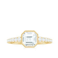 Asscher cut moissanite solitaire engagement ring in bezel setting by Rosec Jewels, showcasing the sparkling center stone and sleek band.