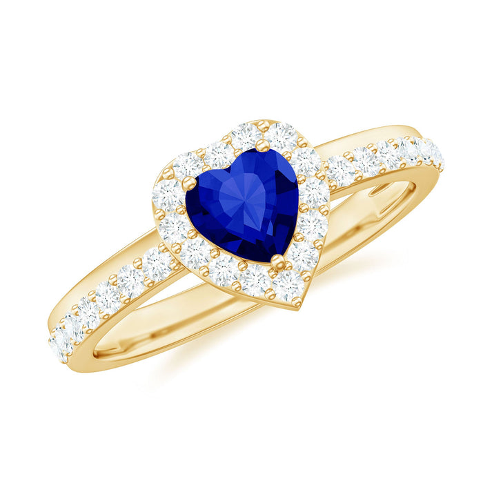 Lab grown blue sapphire heart engagement ring with diamond halo and 0.9 carats from Rosec Jewels, featuring intricate design and sparkling stones.