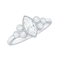 Rosec Jewels Marquise Moissanite engagement ring with three sparkling stones and intricate band detailing.