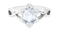 Rosec Jewels 3/4 CT oval moonstone and diamond floral halo ring showing the detailed ring with floral design and sparkling gemstones.