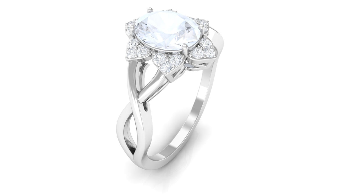 Rosec Jewels 3/4 CT oval moonstone and diamond floral halo ring showcasing a sparkling oval moonstone center with intricate floral diamond accents.