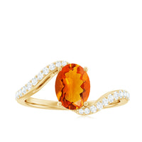 Oval cut fire opal and diamond bypass ring by Rosec Jewels featuring a central fire opal and sparkling diamonds in a modern bypass setting.