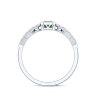 Vintage-looking emerald cut emerald engagement ring with diamond accents by Rosec Jewels, showcasing detailed craftsmanship and elegant design.