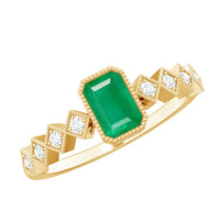 Vintage-style emerald cut emerald engagement ring with diamond accents by Rosec Jewels, showcasing a detailed gold band and sparkling stones.