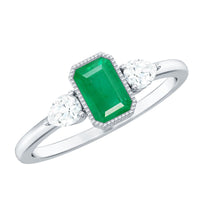 Emerald 3-stone ring with diamonds from Rosec Jewels, showcasing the elegant green emeralds and sparkling diamond accents.