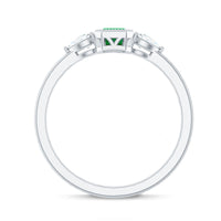 Emerald 3-stone ring with diamond accents from Rosec Jewels, showcasing a elegant design and sparkling gemstones.