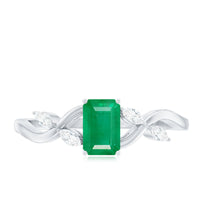 Natural emerald cut emerald engagement ring with diamonds from Rosec Jewels, showcasing elegant design and sparkling gemstone details.