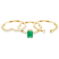 Natural emerald cut diamond and emerald bridal ring set by Rosec Jewels featuring three elegant rings with sparkling gemstones.